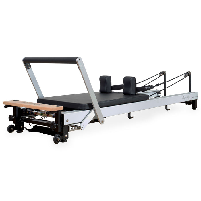 Align-Pilates C8-PRO reformer with a silver aluminum frame, black carriage upholstery and pulley posts, shown without a sitting box or tower.