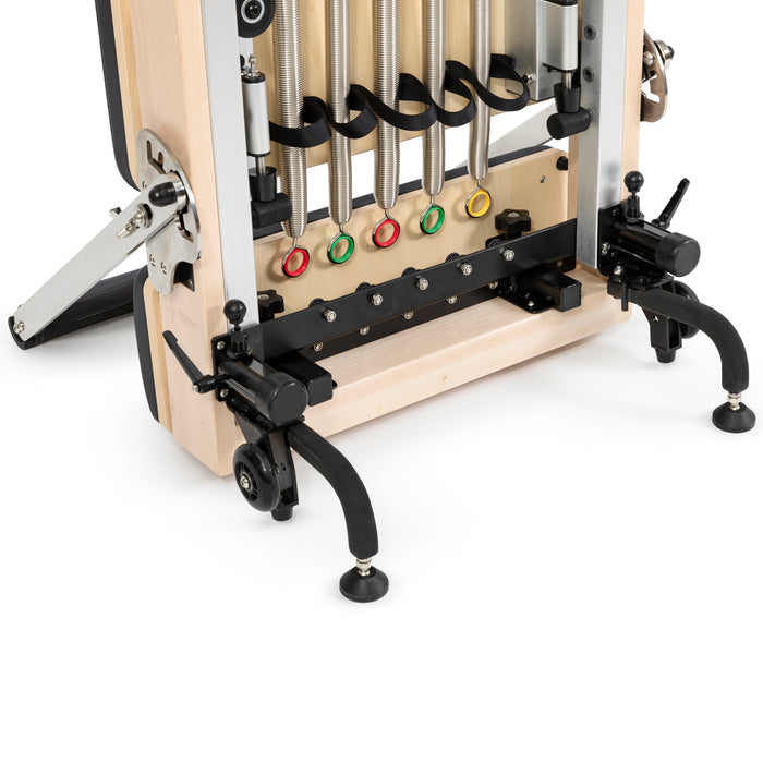 Compact vertical Pilates reformer with accessories



