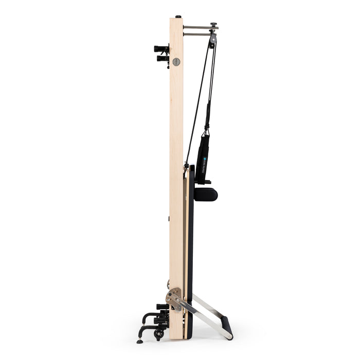 Compact vertical Pilates reformer with accessories

