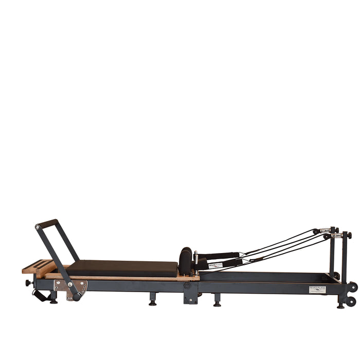 Portable Pilates reformer with adjustable footbar and ergonomic carriage
