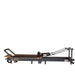 Portable Pilates reformer with adjustable footbar and ergonomic carriage