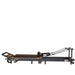 Portable Pilates reformer with adjustable footbar and ergonomic carriage