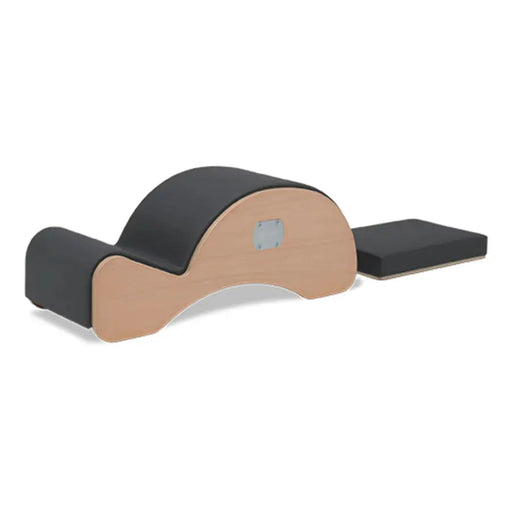 BASI Systems Spine Corrector - side view showing barrel shape and padding