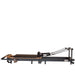 Portable Pilates reformer with adjustable footbar and ergonomic carriage