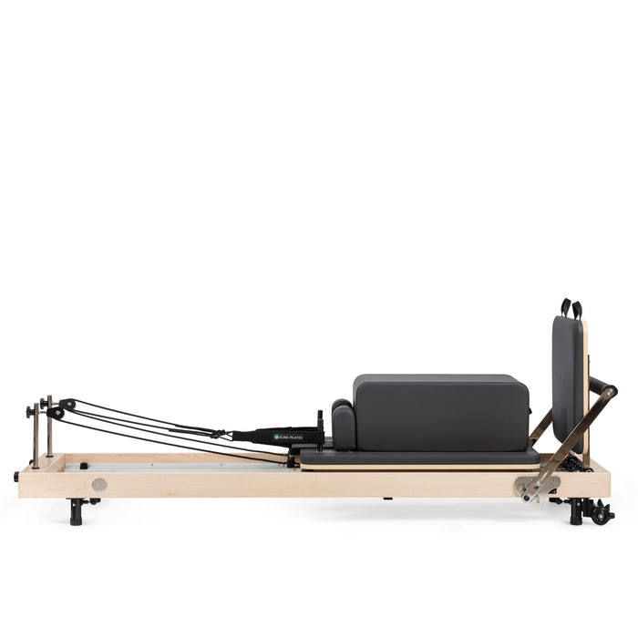 Compact vertical Pilates reformer with accessories

