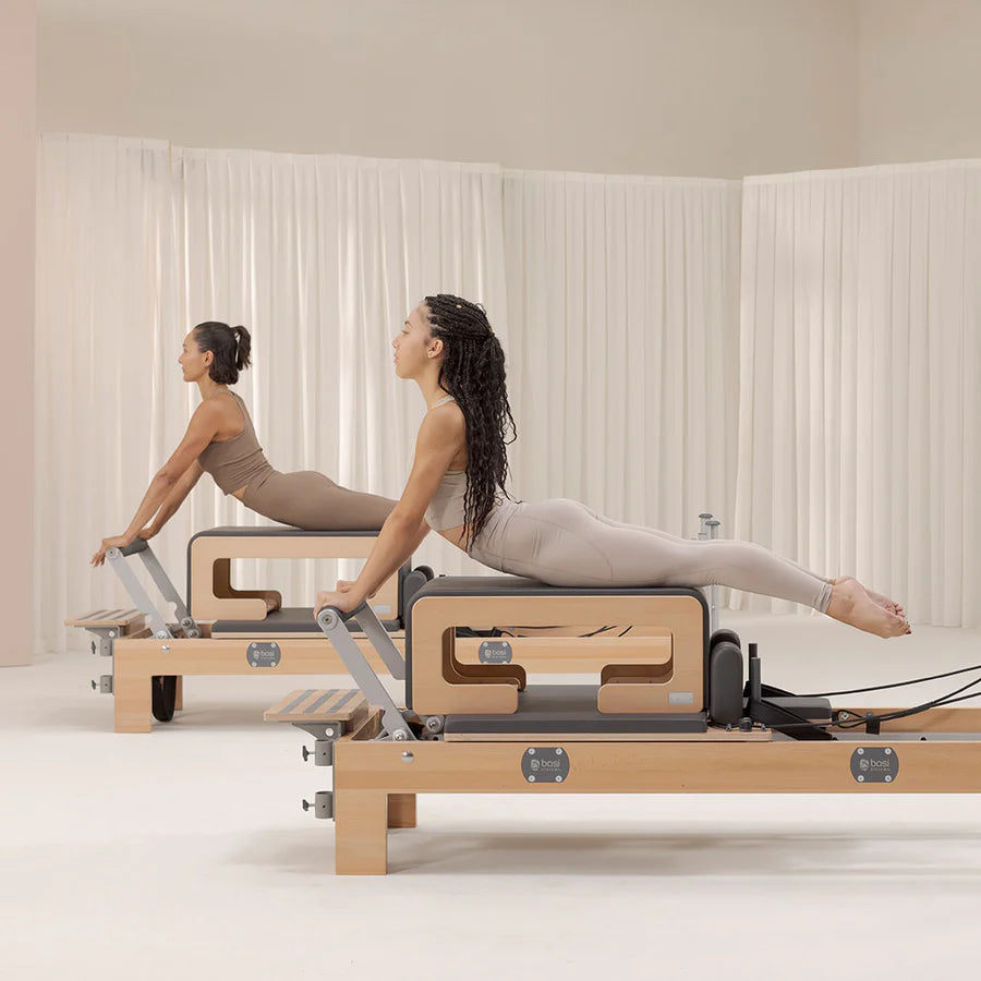 BASI Pilates reformer in a bright indoor setting