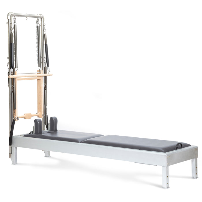 Elina Pilates Classic Reformer with Tower - in-use shot demonstrating exercise position on the reformer