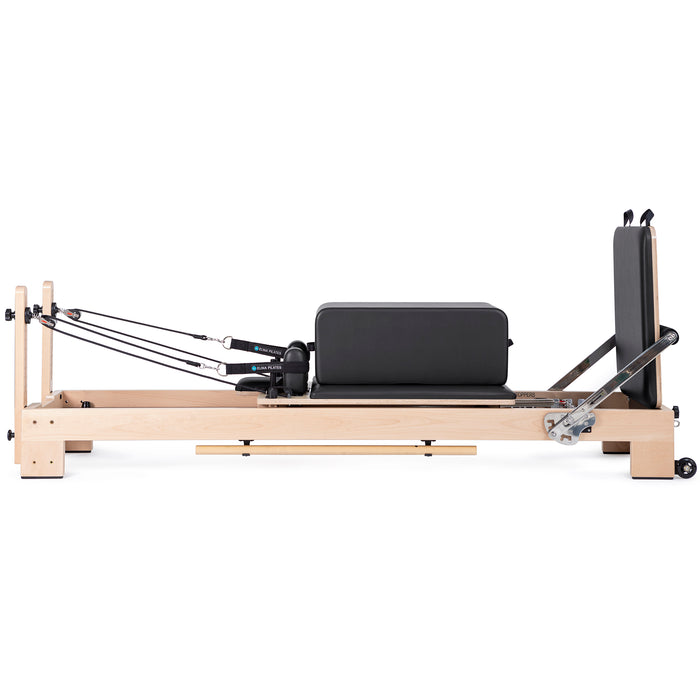 Elina Pilates Lignum Reformer Bundle - in-use shot demonstrating Pilates exercise on wood reformer