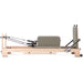 Elina Pilates Lignum Reformer Bundle - angled view highlighting solid wood frame and carriage system