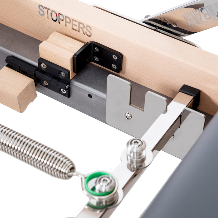 Elina Pilates Lignum Reformer with Tower - overhead view of wooden reformer carriage and footbar system
