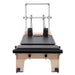 Elina Pilates Master Instructor Reformer Bundle - side view of professional reformer frame with spring system and footbar
