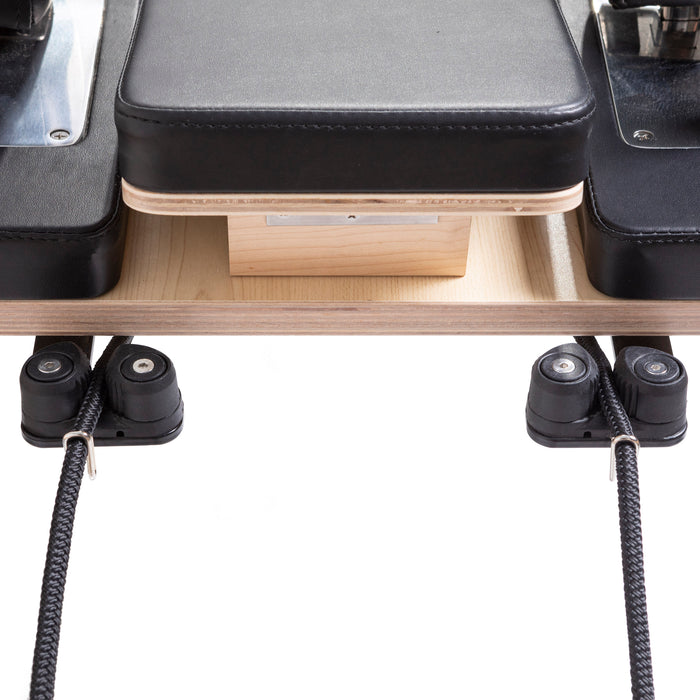 Elina Pilates Master Instructor Reformer Bundle - angled view of reformer bed with gray upholstered carriage surface