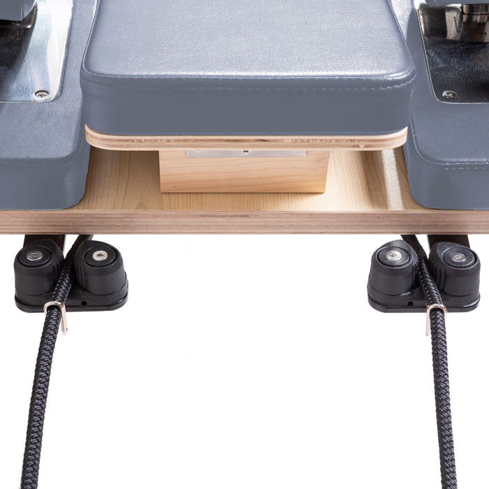Elina Pilates Master Instructor Reformer Bundle - instructor using reformer demonstrating footwork exercise position