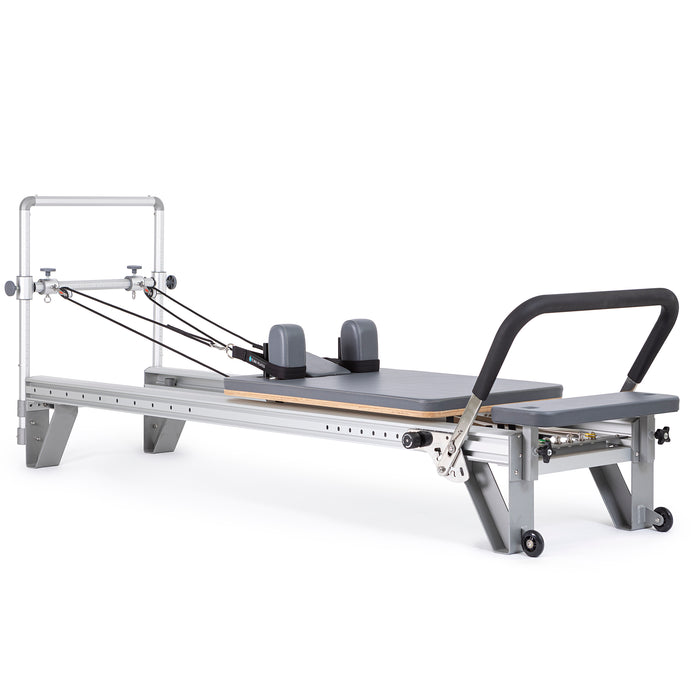 Elina Pilates Mentor Reformer Bundle - in-use shot demonstrating full-body Pilates exercise on mentor reformer
