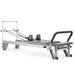Elina Pilates Mentor Reformer Bundle - in-use shot demonstrating full-body Pilates exercise on mentor reformer