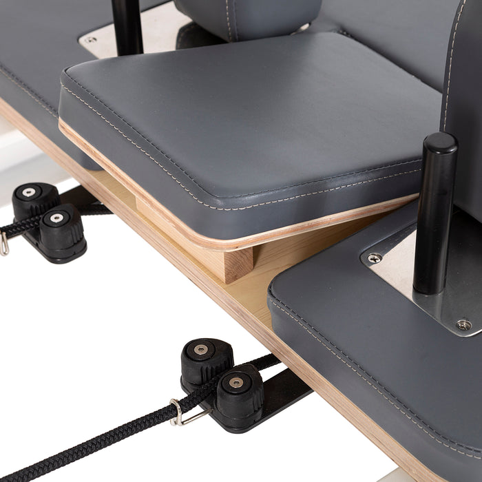 Elina Pilates Nubium Reformer Bundle - second in-use shot showing upper body exercise on nubium reformer
