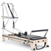 Elina Pilates Twin Reformer - close-up of center divider and independent spring tension controls
