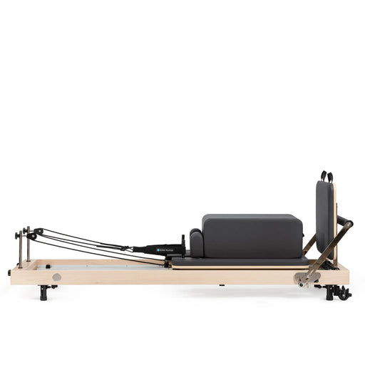 Compact vertical Pilates reformer with accessories

