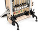 Compact vertical Pilates reformer with accessories



