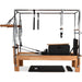 Full Pilates Cadillac Reformer with trapeze, push-through bar, and springs

