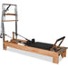 Pilates reformer with tower springs, footbar, and orthopedic sitting box