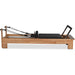 Studio-grade Pilates reformer with ergonomic carriage and footbar

