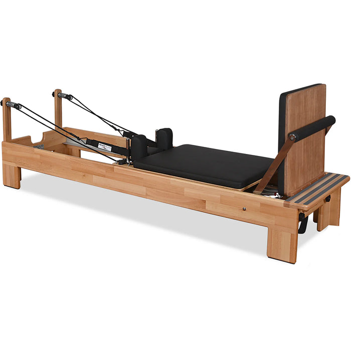 Beechwood Pilates reformer with chrome components and padded platform

