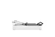 Close-up of adjustable Pilates reformer footbar and shoulder blocks


