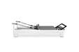 Professional-grade Pilates equipment with jump board and trapeze

