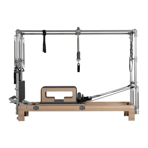BASI Systems Reformer Combo - side profile view showing reformer carriage, tower frame and spring attachment system