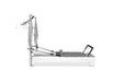 Studio-quality Pilates reformer with push-through bar and jump board