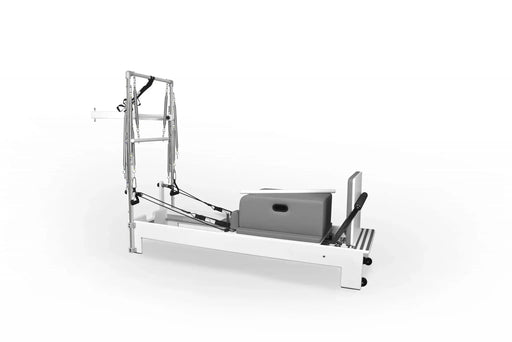 Side view of Private Pilates reformer and stainless steel tower