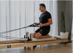 The Core Collab Foldable Pilates Reformer Eco - folded compact position showing space-saving design for home storage