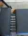 The Core Collab Foldable Pilates Reformer Eco - lifestyle view showing reformer in home gym setting ready for use