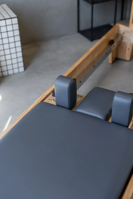 TCC Studio Eco Pilates Reformer - spring and rope pulley system showing resistance adjustment options