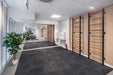 BenchK 700B Black wall bars installed in a training space