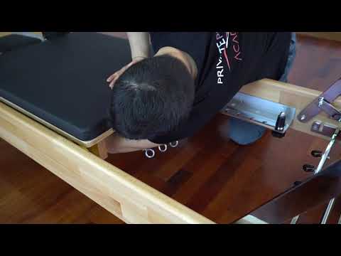 Close-up of Cadillac Reformer footbar and carriage system


