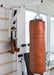 BenchK punching bag hanging from wall bars